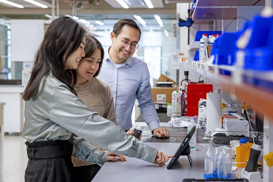 Bryan Ranger and two students in a lab